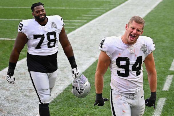 PHOTO: Defensive end Carl Nassib, right, and offensive guard Patrick Omameh of the Las Vegas Raiders celebrate as they walks off the field following the NFL game against the Cleveland Browns at FirstEnergy Stadium on Nov. 01, 2020, in Cleveland. (Jamie Sabau/Getty Images)